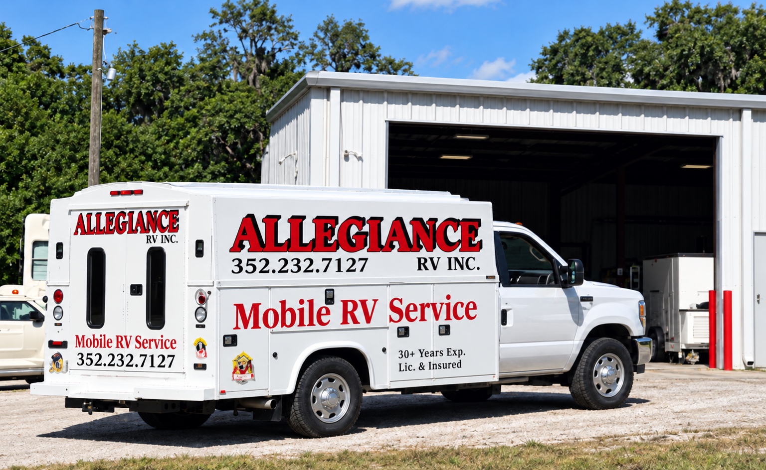 White Allegiance mobile RV service truck with its red branding and phone number visible